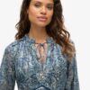 Bedrukte metallic mini-jurk met lange mouwen