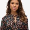 Bedrukte metallic mini-jurk met lange mouwen
