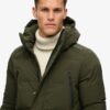 Hooded lange gewatteerde jas met capuchon Hooded lange gewatteerde jas met capuchon