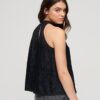 Kanten mouwloze top met hoge hals Kanten mouwloze top met hoge hals