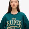 Luxe Sweatjurk met metallic logo Luxe Sweatjurk met metallic logo
